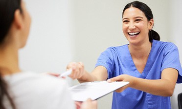 Patient in Chicago talking to dental team about cosmetic dentistry