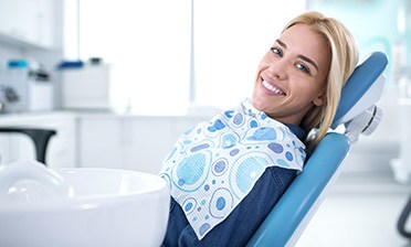 Smiling woman sitting in dental office