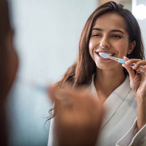 a person brushing their teeth
