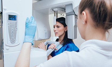 dentist showing a patient their X-rays 