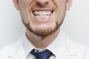 Man in bowtie grinding his teeth